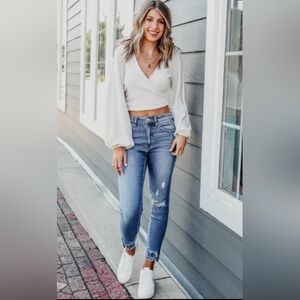 Light blue jeans frayed bottoms